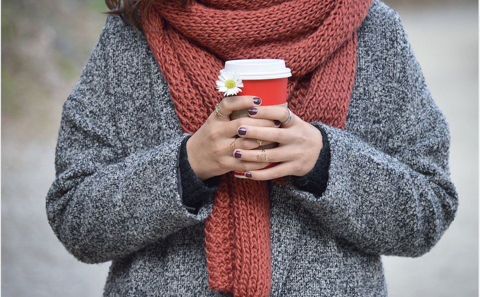 a lady wearing a sweater